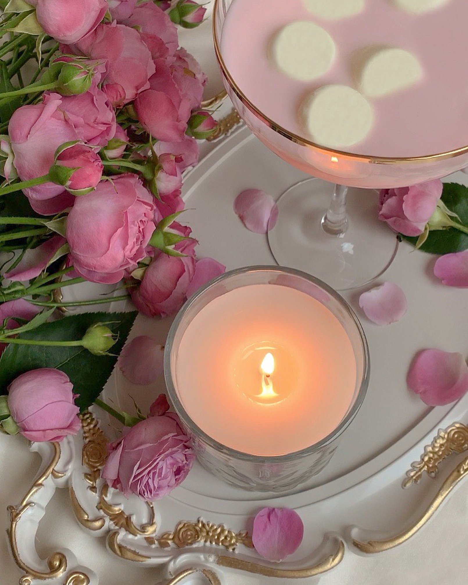 Pink Roses Near a Candle